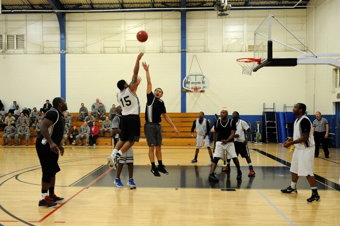 A member of the 9th Aircraft Maintenance Squadron attempts a shot during the Intramural Basketball Championship at the Harris Fitness Center on Beale Air Force Base, Calif., Feb. 22, 2013. The 9th AMXS defeated the 48th Intelligence Squadron 37-34. (U.S. Air Force photo by Staff Sgt. Robert M. Trujillo/Released)
