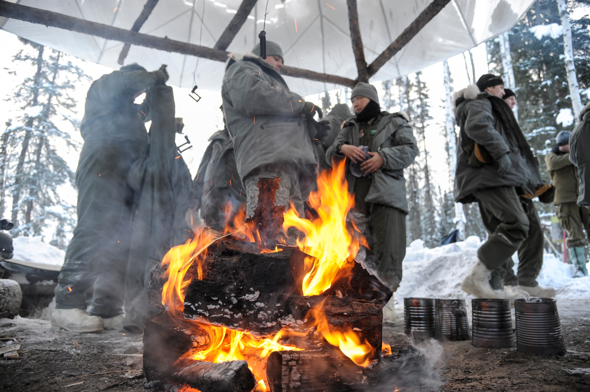 U.S. military members begin their first day of arctic survival training, also known as Cool School, after the morning briefing Feb. 20, 2013, Eielson Air Force Base, Alaska.  The training, conducted by Det. 1, 66th Training Squadron members, exposes students to the harsh extremes of Alaskan winters in a controlled learning evironment.  (U.S. Air Force Photo/Airman 1st Class Peter Reft)