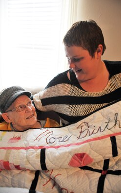 KNOB NOSTER, Mo. -- June Tripp, small cell cancer survivor, and Christi Baldwin, 509th Communication Squadron base operator, display the blanket June won in a raffle at the Hope Lodge when she stayed during her stay. Baldwin has planned a poker tournament in Knob Noster to help benefit the Hope Lodge in Kansas City, Mo. (U.S. Air Force photo/Heidi Hunt)