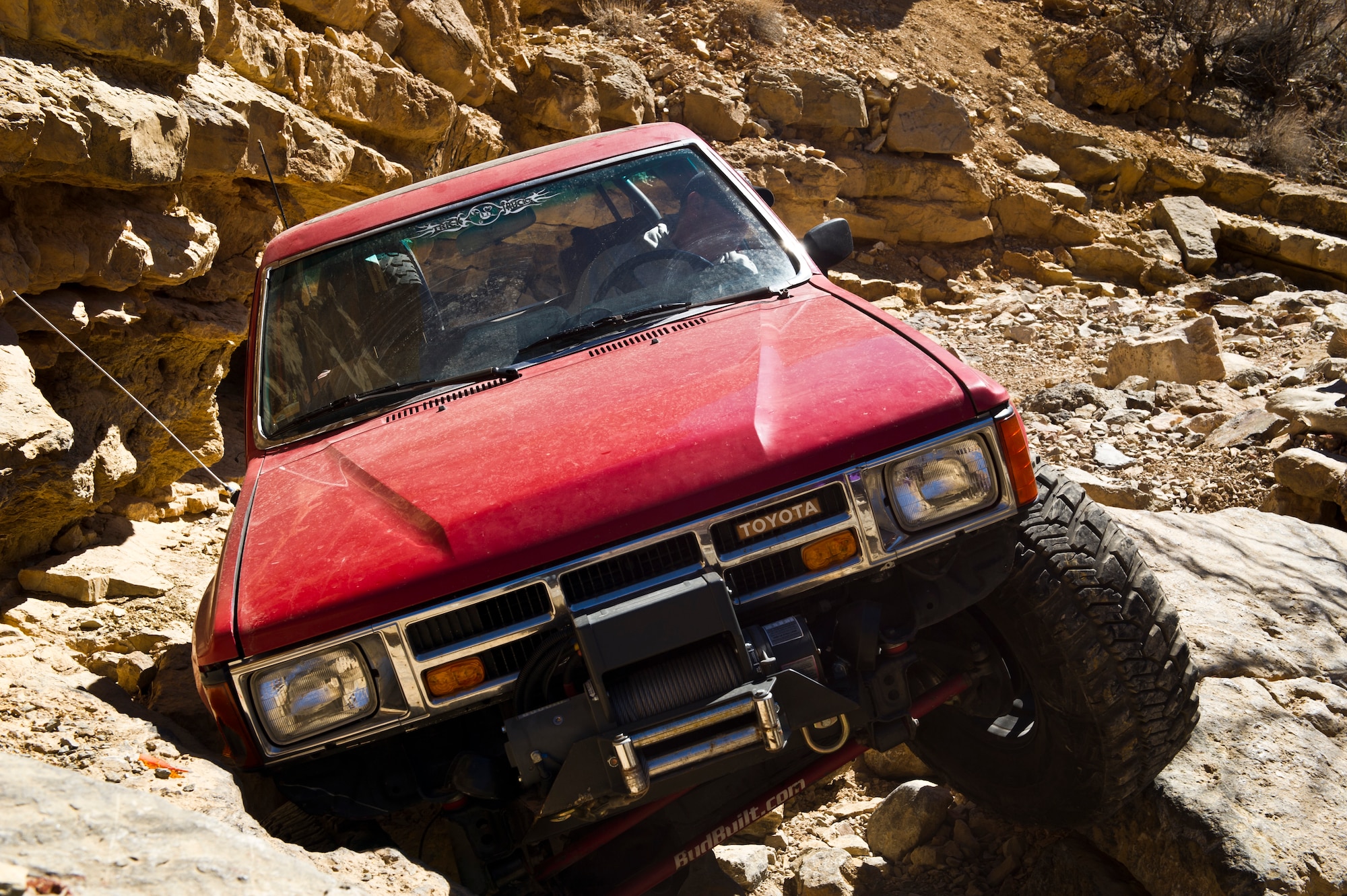 Master Sergeant James (last name withheld due to operations security) drives over an obstacle during the 23rd Annual Chile Challenge Off-Road Trail Event in Las Cruces New Mexico Feb. 21. James has been off-roading for more than 30 years and uses off-roading as a positive outlet to release stress incurred from work and other daily activities. The Chile Challenge, sponsored by the Las Cruces Four-Wheel Drive Club, gave drivers of all experience levels the opportunity to ride on trails led by an experienced trail leader. (U.S. Air Force photo by Senior Airman Joshua Turner/Released)