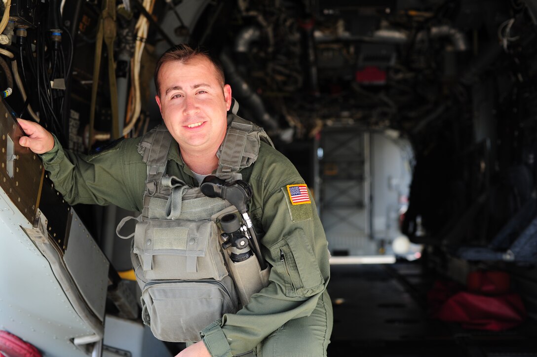 U.S. Air Force Tech. Sgt. Christofer Curtis, a CV-22 flight engineer of the 8th Special Operations Squadron, poses in a CV-22 on the flight line at Hurlburt Field, Fla., April 6, 2012. Curtis returned to active duty after recovering from injuries sustained during a deployment. (U.S. Air Force photo by Airman 1st Class Gustavo Castillo)
