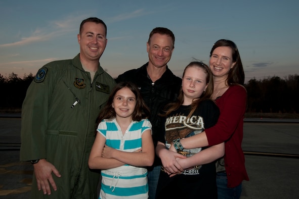 U.S. Air Force Tech. Sgt. Christofer Curtis, a CV-22 flight engineer of the 8th Special Operations Squadron, and his family meet Gary Sinise after the Lt. Dan Band performed a concert for Hurlburt Airmen, family and guests on the flight line at Hurlburt Field, Fla., Feb. 9, 2013. Curtis had previously met Sinise in the hospital while Curtis recovered from injuries sustained during a deployment. (U.S. Air Force photo by Airman 1st Class Naomi M. Griego)