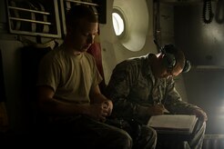 Airman 1st Class Ian Azinger and Airman 1st Class Minh Pham, 437th Aircraft Maintenance Squadron crew chiefs, complete a post flight inspection Feb. 26, 2013, at Joint Base Charleston - Air Base, S.C. Members of the 437th AMXS inspect, service and maintain C-17A aircraft to enable them to perform assigned global airlift missions ranging from combat support operations and humanitarian relief to aeromedical evacuations. (U.S. Air Force photo/ Senior Airman George Goslin)