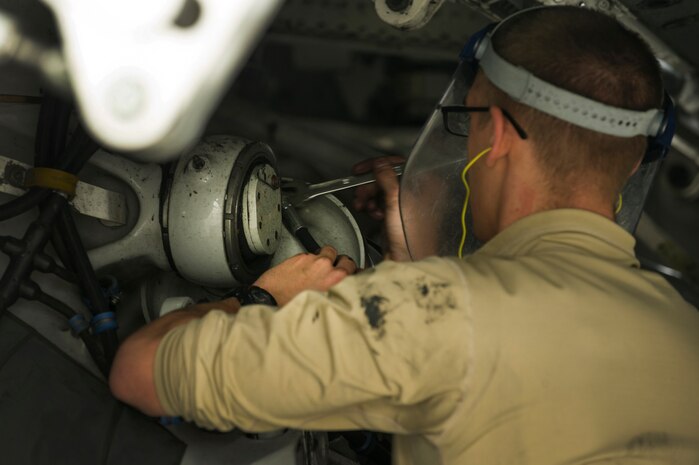 Airman 1st Class Mitchell Hogue, 437th Aircraft Maintenance Squadron crew chief, performs suspension maintenance during a post flight inspection Feb. 26, 2013, at Joint Base Charleston - Air Base, S.C. Members of the 437th AMXS inspect, service and maintain C-17A aircraft to enable them to perform assigned global airlift missions ranging from combat support operations and humanitarian relief to aeromedical evacuations. (U.S. Air Force photo/ Senior Airman George Goslin)