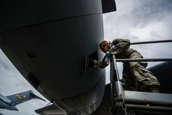 Airman Cory Parks, 437th Aircraft Maintenance Squadron crew chief, services oil on a Globemaster III C-17 engine during a post-flight inspection Feb. 26, 2013, at Joint Base Charleston - Air Base, S.C. Members of the 437th AMXS inspect, service and maintain C-17A aircraft to enable them to perform assigned global airlift missions ranging from combat support operations and humanitarian relief to aeromedical evacuations. (U.S. Air Force photo/ Senior Airman George Goslin)