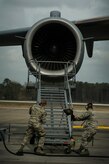 Airman 1st Class Minh Pham and Airman Cory Parks, 437th Aircraft Maintenance Squadron crew chiefs, move a B-1 Stand into position during a post-flight inspection Feb. 26, 2013, at Joint Base Charleston - Air Base, S.C. Members of the 437th AMXS inspect, service and maintain C-17A aircraft to enable them to perform assigned global airlift missions ranging from combat support operations and humanitarian relief to aeromedical evacuations. (U.S. Air Force photo/ Senior Airman George Goslin)