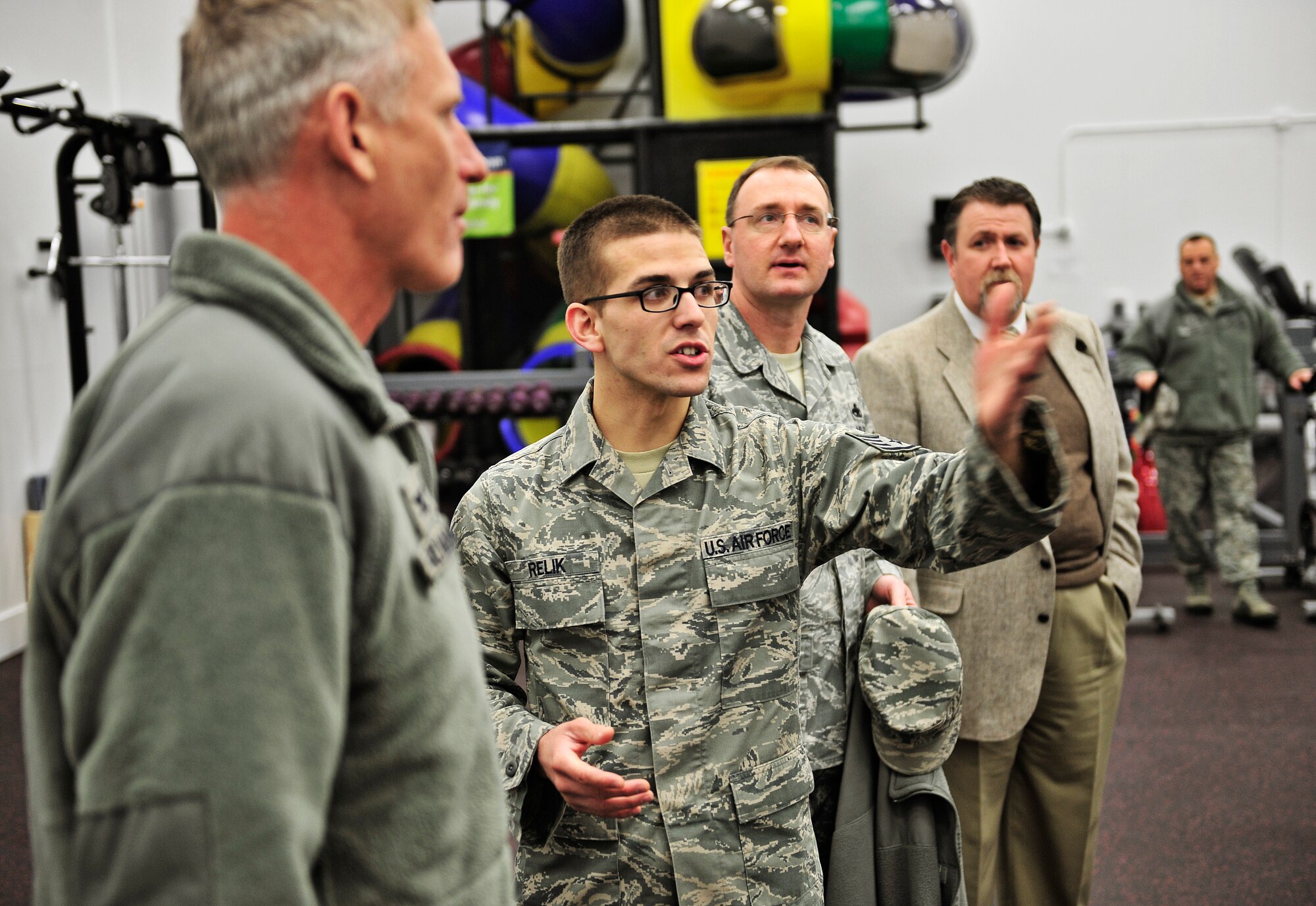 Staff Sgt. Jason Relik, 375th Force Support Squadron, explains a new piece of workout equipment to Col. David Almand, 375th Air Mobility Wing commander, during a tour of the new high intensity training room Feb. 20. The James Sports Center recently completed construction on the new room geared toward a high intensity workout that patrons were unable to perform previously. The room also has a contained children's play area with playground equipment, children's cardio machines and an entertainment center.  (U.S. Air Force photo/ Staff Sgt. Ryan Crane)