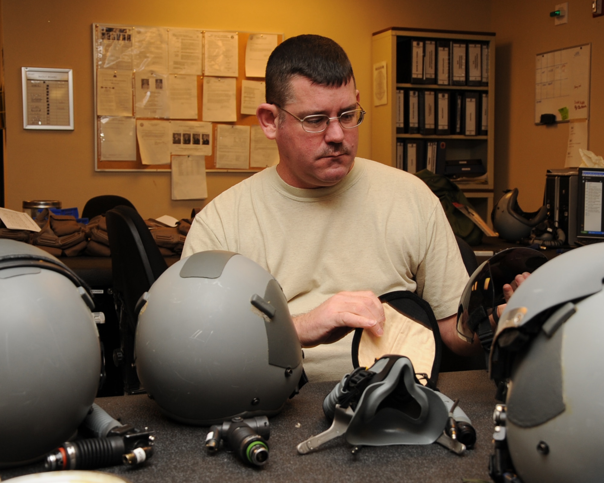 Master Sgt. Jeffrey Ortiz, 2nd Operation Support Squadron Aircrew Flight Equipment flight chief, performs a quality assurance check on aircrew helmets on Barksdale Air Force Base, La., Feb. 27. AFE Airmen provide aircrew with the proper lifesaving equipment used in the event of a crash including helmets, oxygen masks, survival vests, anti-exposure suits, life preservers and night vision goggles. (U.S. Air Force photo/Senior Airman Sean Martin)