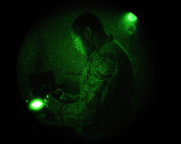 Airman 1st Class Delonte Vance, 2nd Operation Support Squadron Aircrew Flight Equipment journeyman, performs a functions check on a set of night vision goggles to on Barksdale Air Force Base, La., Feb. 27. Airmen from the 2 OSS AFE shop provide aircrew with the proper lifesaving equipment used in the event of a crash including helmets, oxygen masks, survival vests, anti-exposure suits, life preservers and night vision goggles. (U.S. Air Force photo/Senior Airman Sean Martin)