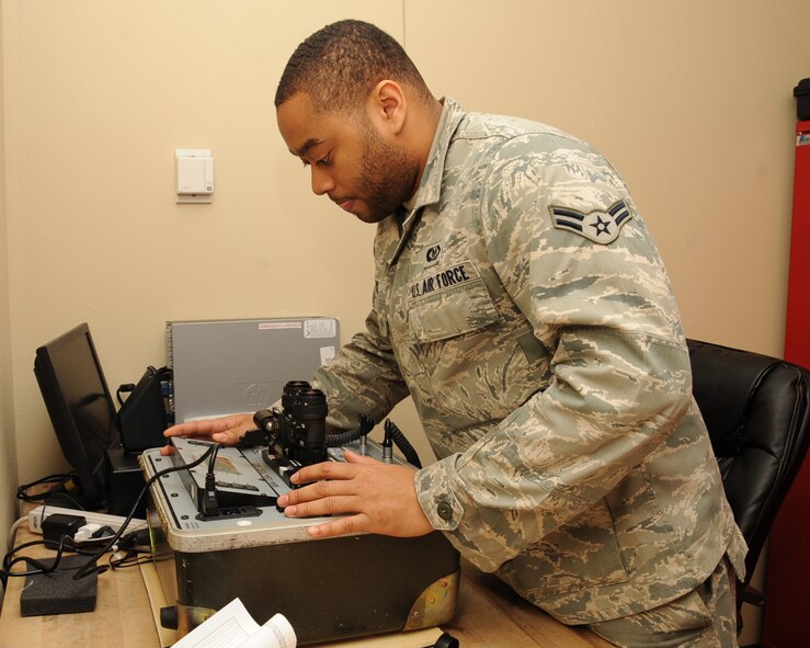Airman 1st Class Delonte Vance, 2nd Operation Support Squadron Aircrew Flight Equipment journeyman, performs a functions check on a set of night vision goggles to on Barksdale Air Force Base, La., Feb. 27. Airmen from the 2 OSS AFE shop provide aircrew with the proper lifesaving equipment used in the event of a crash including helmets, oxygen masks, survival vests, anti-exposure suits, life preservers and night vision goggles. (U.S. Air Force photo/Senior Airman Sean Martin)