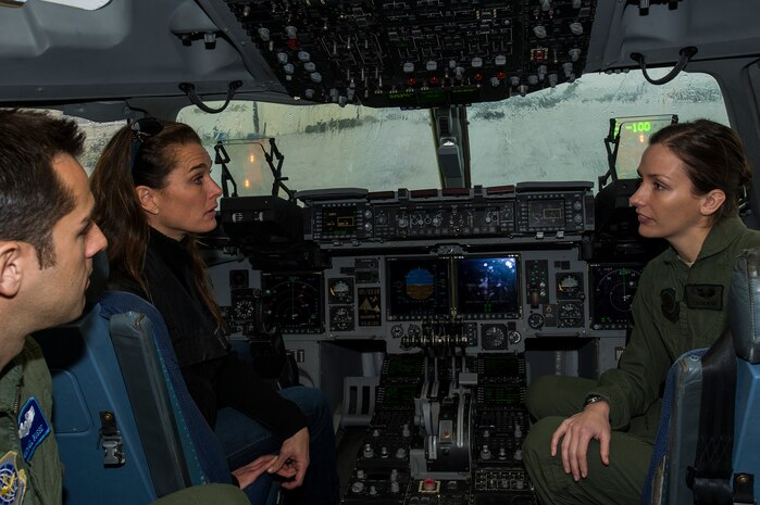 Captain Michael Busse and 1st Lt. Lauren Hoyt, 16th Airlift Squadron pilots, explain C-17 Globemaster III cockpit procedures to actress Brooke Shields Feb. 22, 2013, at Joint Base Charleston-Air Base, S.C. Shields was at JB Charleston preparing for her upcoming role on the TV series Army Wives. (U.S. Air Force photo/Staff Sgt. Rasheen Douglas