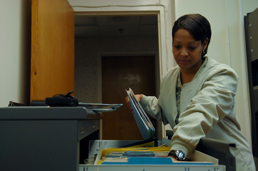 Rika Johnson, 633rd Medical Group allergy nurse, files patient records, Feb. 21, 2013, at U.S. Air Force Hospital Langley, Va. With the addition of an allergist last December, the allergy clinic sees approximately 25 percent more patients a week. (U.S. Air Force photo by Airman 1st Class Austin Harvill/Released)