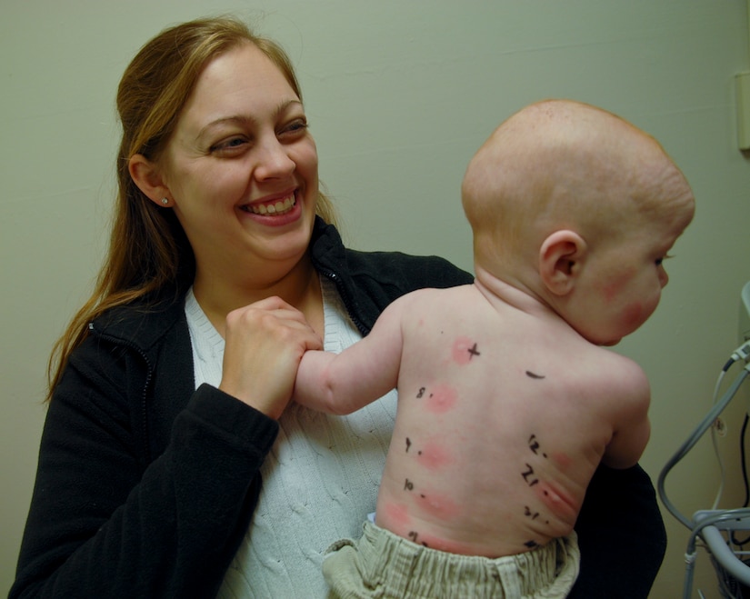 A mother and her child play while they wait for a skin prick test to incite a reaction, Feb. 21, 2013, at U.S. Air Force Hospital Langley, Va. Although the clinic produces allergic reactions during a skin prick test, the reaction is not strong enough to cause any serious reaction. (U.S. Air Force photo by Airman 1st Class Austin Harvill/Released)