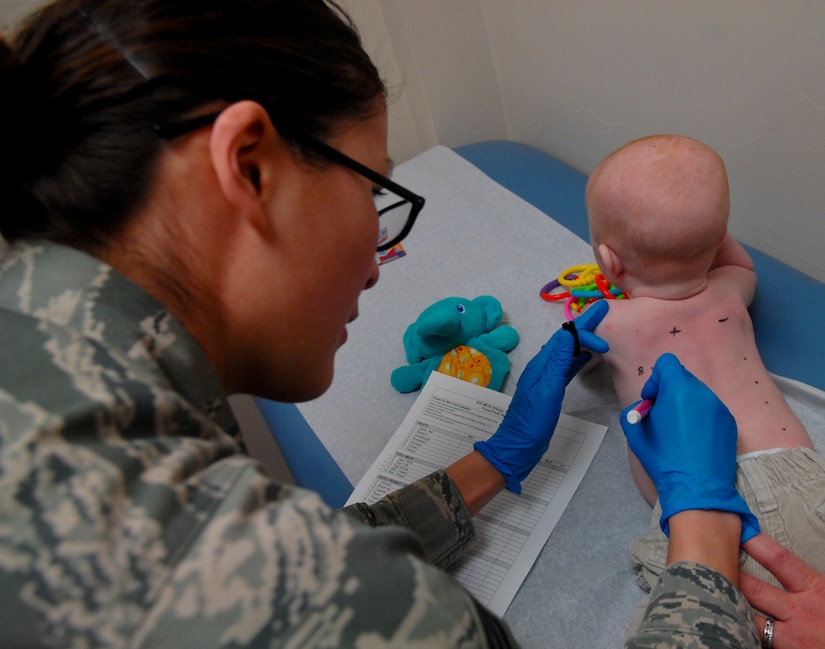 Senior Airman Catherine Settles, 633rd Medical Group aerospace medical technician, numbers a baby’s back to record which allergen will be applied for a skin prick test, Feb. 21, 2013, at U.S. Air Force Hospital Langley, Va. The allergy clinic also conducts skin patch and oral challenge tests in order to find a patient’s allergies. (U.S. Air Force photo by Airman 1st Class Austin Harvill/Released)