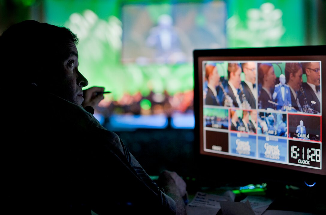 Senior Master Sgt. Jebodiah Eaton, U.S. Air Force Band member, monitors the video feed during the Guest Artist Series concert at the Daughters of the American Revolution Constitution Hall in Washington D.C., Feb. 24, 2013. The Rouges, a Celtic rock band, performed as the guest artists. (U.S. Air Force photo/ Staff Sgt. Perry Aston)(Released)