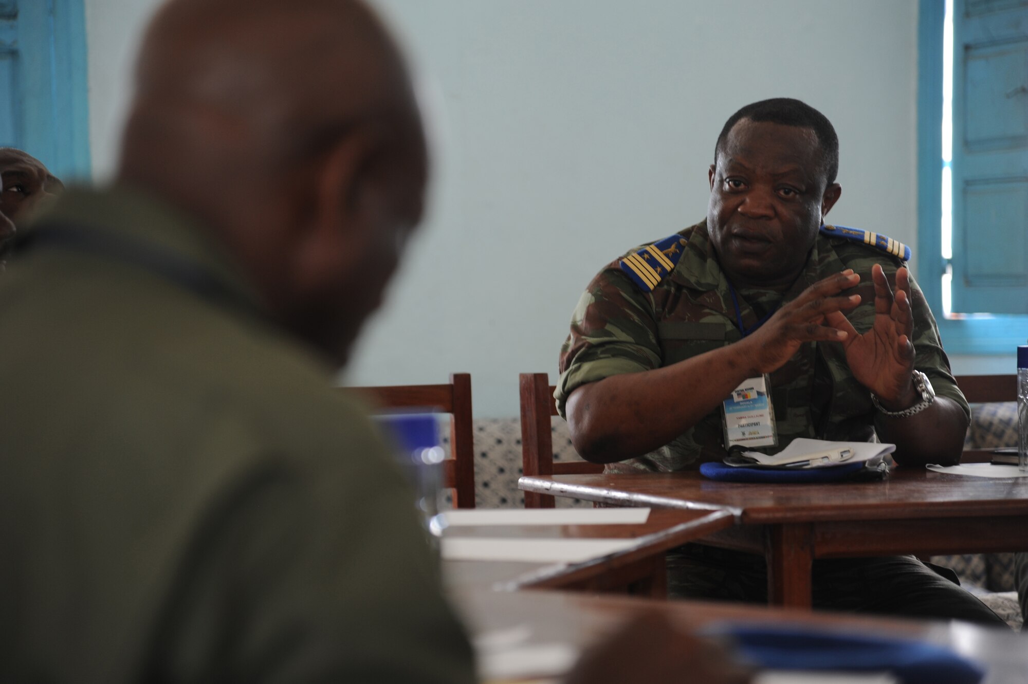 DOUALA, CAMEROON – Cameroon Air Force Col. Yamba Guillaume, C-130 pilot, and U.S. Air Force air advisors assigned to the 818th Mobility Support Advisory Squadron, Joint Base McGuire-Dix-Lakehurst, N.J., share ideas regarding aerial delivery systems at Douala Air Force Base, Douala, Cameroon, Feb. 21, 2013. Central Accord 2013 is a joint exercise in which U.S., Cameroon and neighboring Central African militaries partner to promote regional cooperation while and increasing aerial resupply and medical readiness capacity. (Photo by Master Sgt. Stan Parker, 621st CRW Public Affairs)