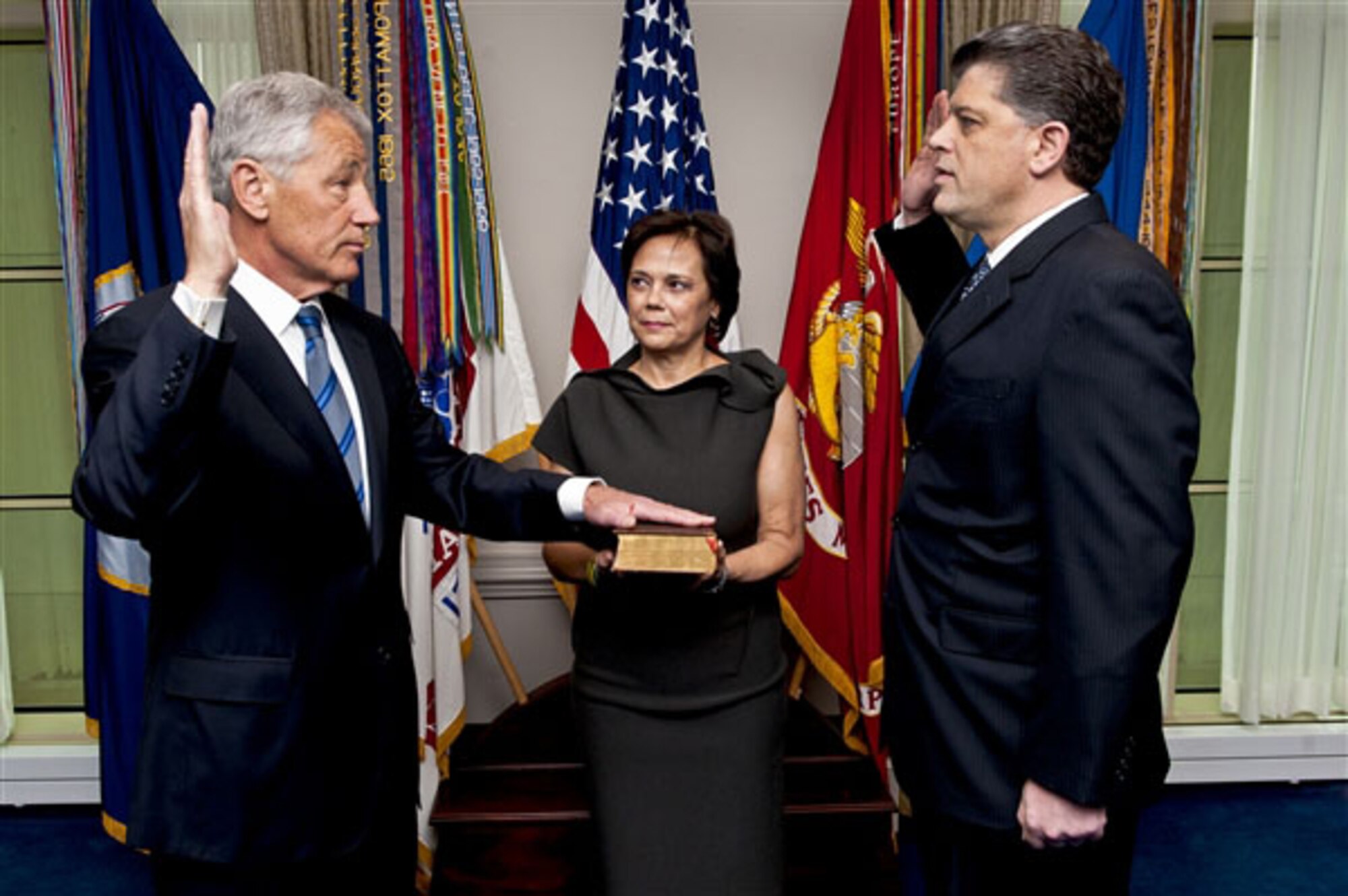Chuck Hagel is sworn into office Feb. 27, 2013, by Michael L. Rhodes, the Defense Department's director of administration and management, as Hagel's wife, Lilibet, holds a Bible at the Pentagon. (DOD photo by U.S. Navy Petty Officer 1st Class Chad J. McNeeley)