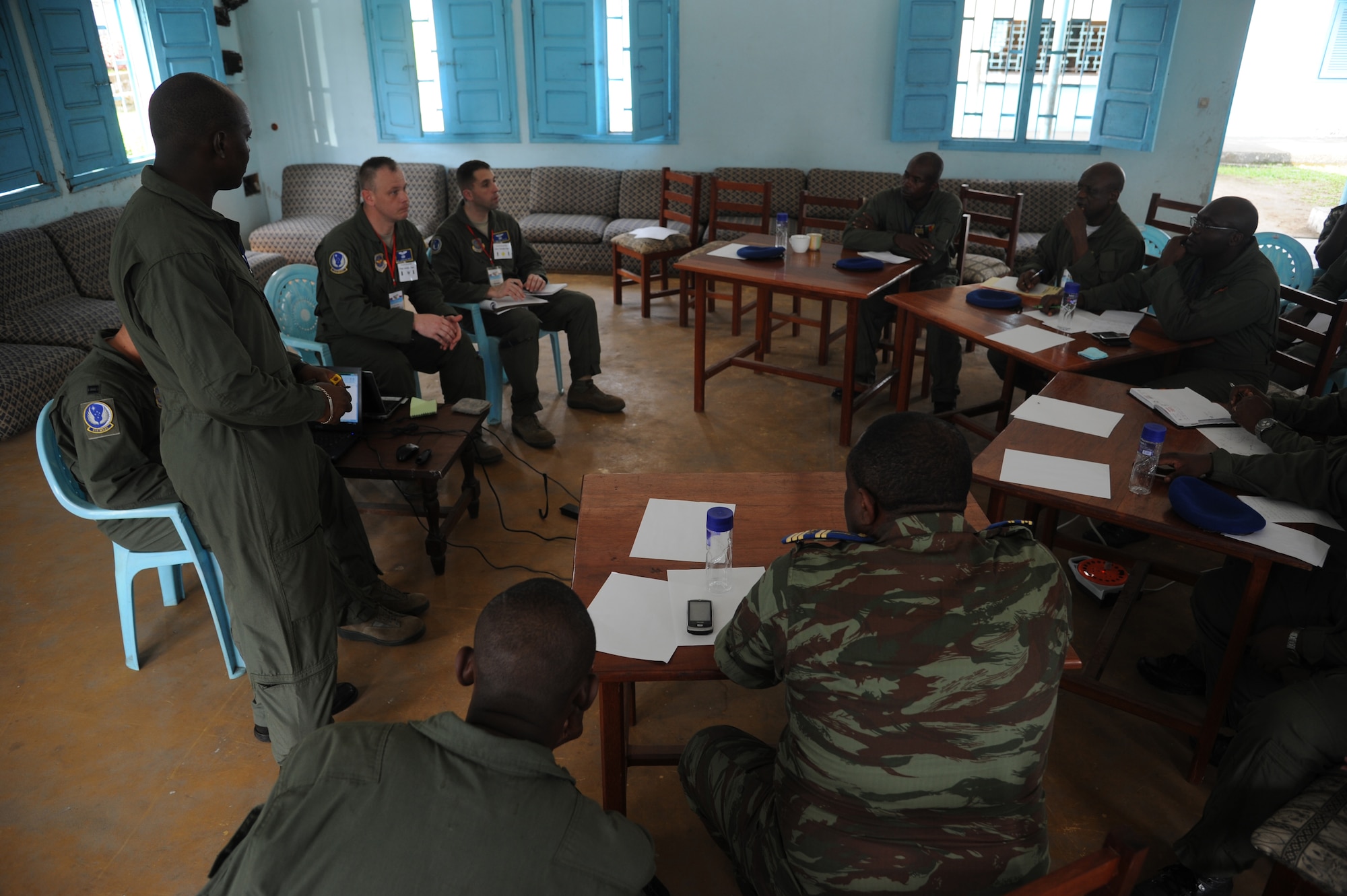 DOUALA, CAMEROON – U.S. Air Force air advisors assigned to the 818th Mobility Support Advisory Squadron, Joint Base McGuire-Dix-Lakehurst, N.J. and Cameroon Air Force personnel, share ideas regarding aerial delivery systems at Douala Air Force Base, Douala, Cameroon, Feb. 21, 2013. Central Accord 2013 is a joint exercise in which U.S., Cameroon and neighboring Central African militaries partner to promote regional cooperation while and increasing aerial resupply and medical readiness capacity. (Photo by Master Sgt. Stan Parker, 621st CRW Public Affairs)
