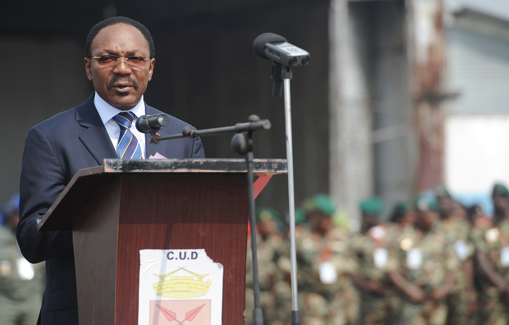 DOUALA, CAMEROON –  Dr. Fritz NTone' NTone', the government delegate to the Douala City Council, gives his remarks during the opening ceremony for Central Accord 13, at Douala Air Force Base, airfield, Douala, Cameroon, Feb. 20, 2013. Central Accord 2013 is a joint exercise in which U.S., Cameroon and neighboring Central African militaries partner to promote regional cooperation while and increasing aerial resupply and medical readiness capacity. (Photo by Master Sgt. MSgt Stan Parker, 621st CRW Public Affairs)