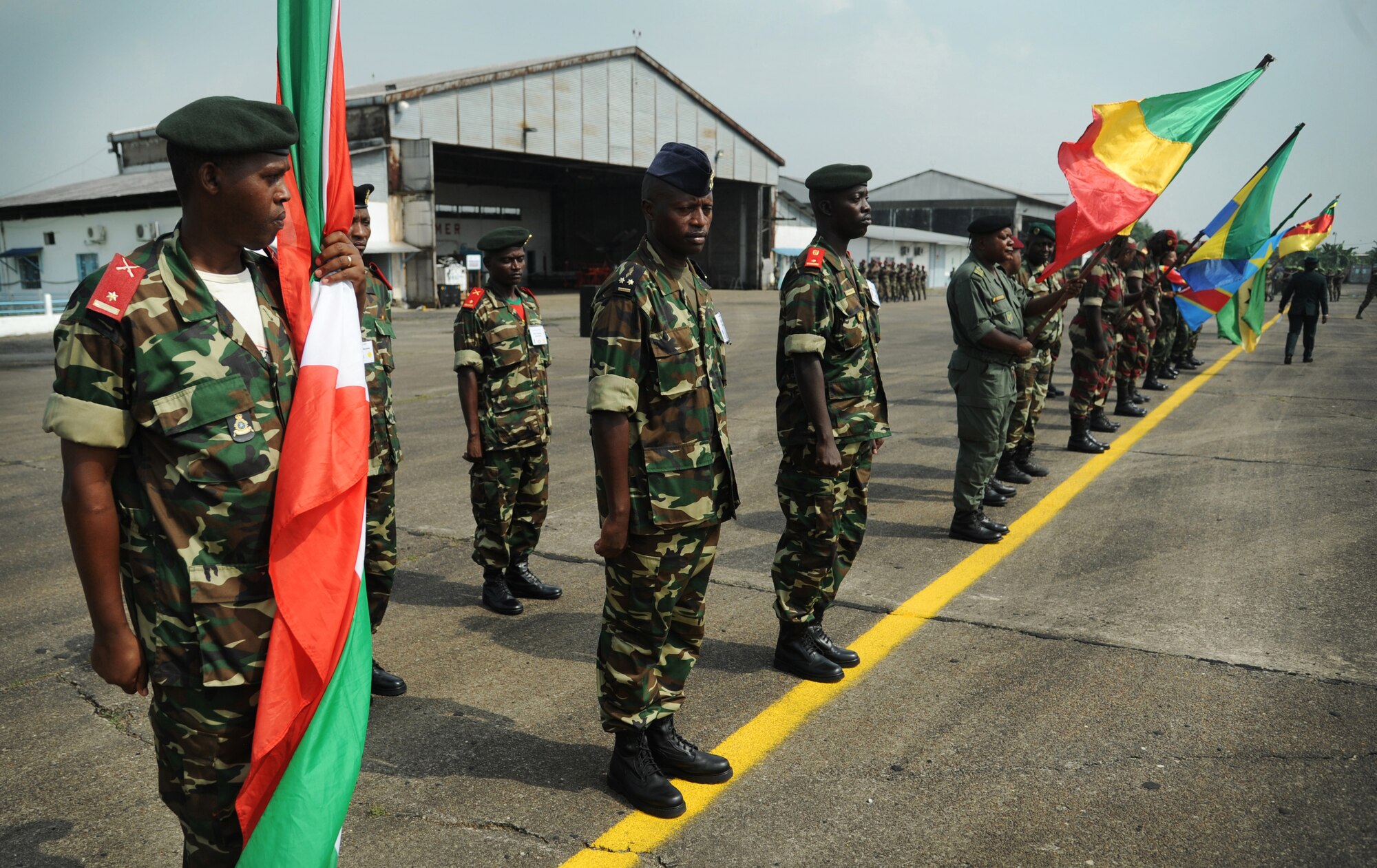DOUALA, CAMEROON – African partner nation participants stand in formation during the opening ceremony for Central Accord 2013, at Douala Air Force Base, Douala, Cameroon, Feb. 20, 2013. Central Accord 2013 is a joint exercise in which U.S., Cameroon and neighboring Central African militaries partner to promote regional cooperation while and increasing aerial resupply and medical readiness capacity. (Photo by Master Sgt. MSgt Stan Parker, 621st CRW Public Affairs)