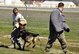 The Iron Dawg competition, held at the March Field Air Museum, Sunday, Feb. 17, attracted spectators from all over southern California to watch current and veteran military working dog handlers and their K9’s compete for Top Dawg honors. Shown, is a MWD attacking two separate aggressors. The K9’s were required to attack the first aggressor, then release and attack the second during the bite work phase of the competition. (U.S. Air Force photo by Megan Crusher)