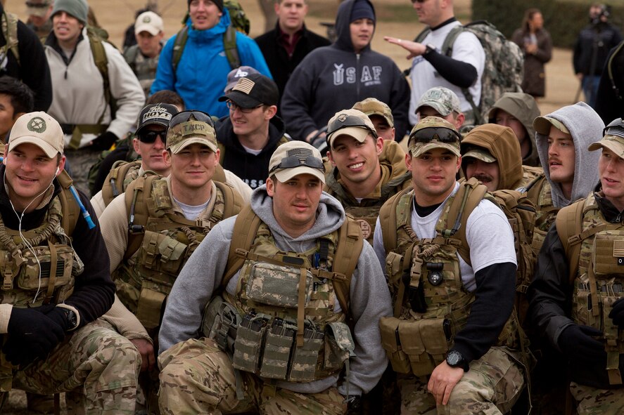 Members of P275 Training Course, Camp Gruerber, Oklahoma, take a knee for instructions before the start of the Major David Gray Memorial Ruck March on February 9, 2013. The march took place in Tulsa, Oklahoma's Veterans Park and River Park Trails and was hosted by the 138th Combat Training Flight. (U. S. Air Force Photo by MSgt Mark A. Moore)