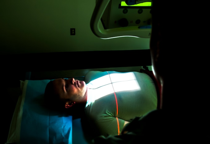 Staff Sgt. Carl Doan, 628th Medical Group diagnostic imaging craftsman, practices administering an x ray to Staff Sgt. John Bartlett, 628th MDG medical technician, Feb. 27, 2013 at Joint Base Charleston – Air Base, S.C. Bartlett is receiving a chest radiograph, which is used to diagnose conditions affecting the chest, its contents and nearby structures. (U.S. Air Force photo / Airman 1st Class Tom Brading)