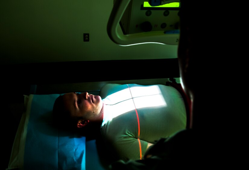 Staff Sgt. Carl Doan, 628th Medical Group diagnostic imaging craftsman, practices administering an x ray to Staff Sgt. John Bartlett, 628th MDG medical technician, Feb. 27, 2013 at Joint Base Charleston – Air Base, S.C. Bartlett is receiving a chest radiograph, which is used to diagnose conditions affecting the chest, its contents and nearby structures. (U.S. Air Force photo / Airman 1st Class Tom Brading)