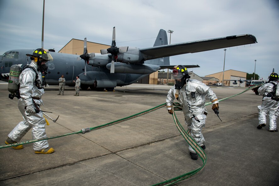 23d Civil Engineer Squadron firefighters respond to an aircraft fire during a phase I operational readiness exercise Feb. 25, 2013, at Moody Air Force Base, Ga. During the scenario, the firefighters extinguished a blaze and extracted two pilots from a burning HC-130P Combat King. (U.S. Air Force photo by Staff Sgt. Jamal D. Sutter/Released) 