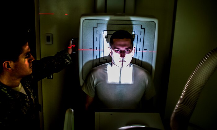 Staff Sgt. Carl Doan, 628th Medical Group diagnostic imaging craftsman, practices administering an x ray to Staff Sgt. John Bartlett, 628th MDG medical technician, Feb. 27, 2013 at Joint Base Charleston – Air Base, S.C. Bartlett is receiving a chest radiograph, which is used to diagnose conditions affecting the chest, its contents and nearby structures. (U.S. Air Force photo / Airman 1st Class Tom Brading)