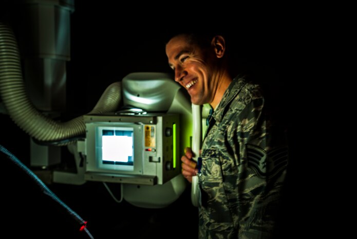 Staff Sgt. Carl Doan, 628th Medical Group diagnostic imaging craftsman, practices administering an x ray Feb. 27, 2013 at Joint Base Charleston – Air Base, S.C. X rays are a form of electromagnetic radiation and use the physical properties of the ray to create an image that can be developed for a radiologist. (U.S. Air Force photo / Airman 1st Class Tom Brading)
