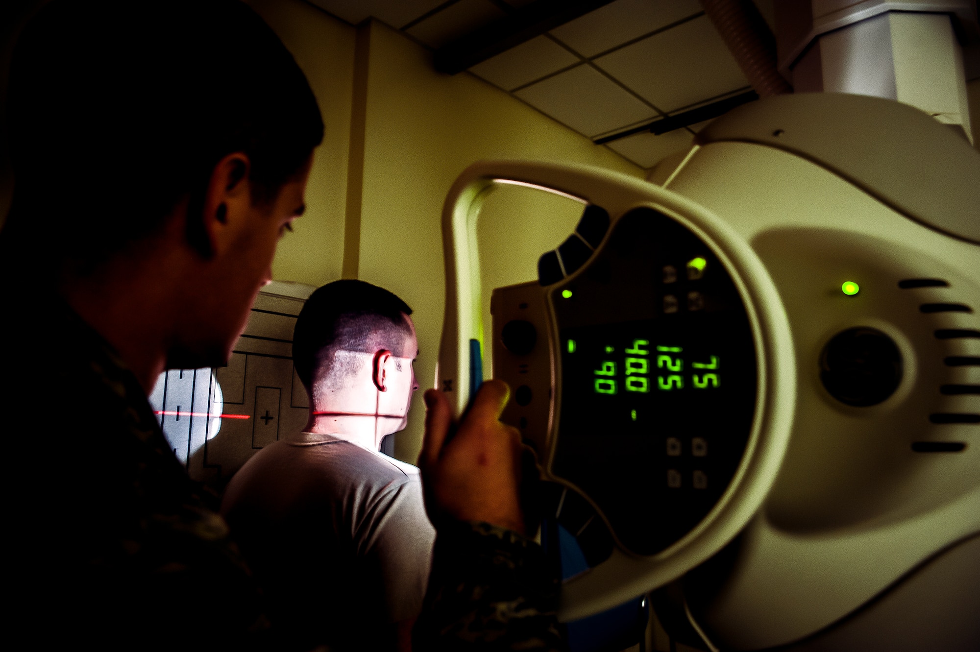Staff Sgt. Carl Doan, 628th Medical Group diagnostic imaging craftsman, practices administering an x ray to Staff Sgt. John Bartlett, 628th MDG medical technician, Feb. 27, 2013 at Joint Base Charleston – Air Base, S.C. Doan is focusing on the cervical vertebrae, or c-spine, which is located in the upper body and is typical of neck injuries. (U.S. Air Force photo / Airman 1st Class Tom Brading) 