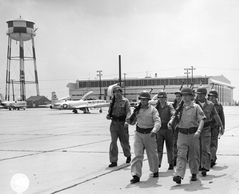 North Carolina Air National Guard, NCANG, 145 Airlift Wing, 145 AW, 156 Fighter Interceptor Squadron (FIS), Late 1950's Early 1960's Riot Control Training, Flight Leader Clyde Smith, Front Rank, Left to Right, #1 Unk, #2 Unk, Second Rank, Left to Right, #1 Unk, #2 Unk, Third Rank, Left to Right, #1 Unk, #2 Worth (Squrril) Russell, Fourth Rank, Barely Visable, Unk  (Photo by NCANG Heritage Program)