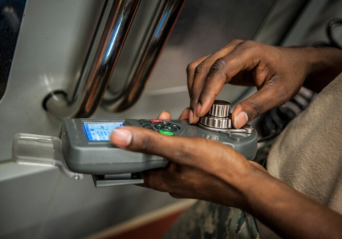 Airman 1st Class Tashma Antoine, 437th Maintenance Squadron aircraft metals apprentice, uses a hand held device to operate a mill machine Feb. 26, 2013, at Joint Base Charleston – Air Base, S.C. Antoine is assigned to the aircraft metals fabrication shop and is trained to use several different pieces of equipment to bend, cut and combine metals. Antoine is originally from Fort Myers, Fla. (U.S. Air Force photo/ Senior Airman Dennis Sloan)