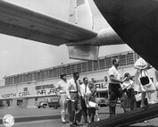North Carolina Air National Guard, NCANG, 145 Airlift Wing, 145 AW, 1961-1962 Open House, Visitors walk up the ramp of a C-119.  Charlotte Base  (Photo by NCANG Heritage Program)