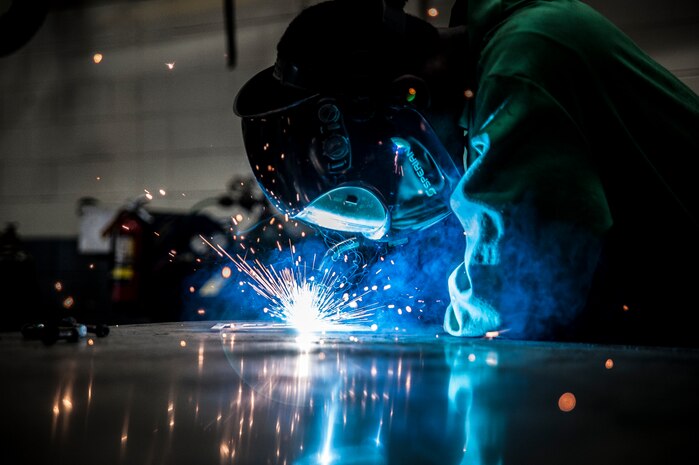 Airman 1st Class Tashma Antoine, 437th Maintenance Squadron aircraft metals apprentice, performs an inert gas weld Feb. 26, 2013, at Joint Base Charleston – Air Base, S.C. In inert gas welding, an arc is struck between an electrode and the sheet metal to be welded. Antoine is assigned to the aircraft metals fabrication shop and is trained to use several different pieces of equipment to bend, cut and combine metals. Antoine is originally from Fort Myers, Fla. (U.S. Air Force photo/ Senior Airman Dennis Sloan)