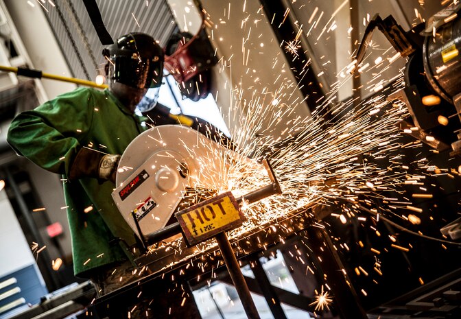 Airman 1st Class Tashma Antoine, 437th Maintenance Squadron aircraft metals apprentice, cuts a steel rod with an abrasive saw Feb. 26, 2013, at Joint Base Charleston – Air Base, S.C. Antoine is assigned to the aircraft metals fabrication shop and is trained to use several different pieces of equipment to bend, cut and combine metals. Antoine is originally from Fort Myers, Fla. (U.S. Air Force photo/ Senior Airman Dennis Sloan)