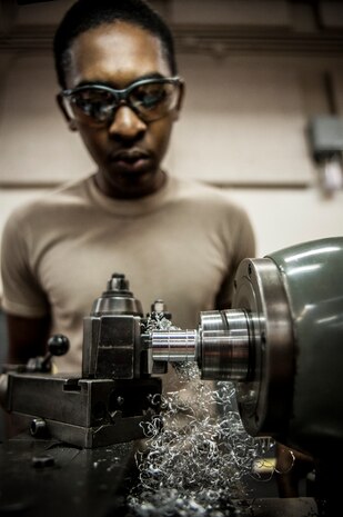 Airman 1st Class Tashma Antoine, 437th Maintenance Squadron aircraft metals apprentice, uses a lathe to reduce the diameter of a metal rod Feb. 26, 2013, at Joint Base Charleston – Air Base, S.C. Antoine is assigned to the aircraft metals fabrication shop and is trained to use several different pieces of equipment to bend, cut and combine metals. Antoine is originally from Fort Myers, Fla. (U.S. Air Force photo/Senior Airman Dennis Sloan)