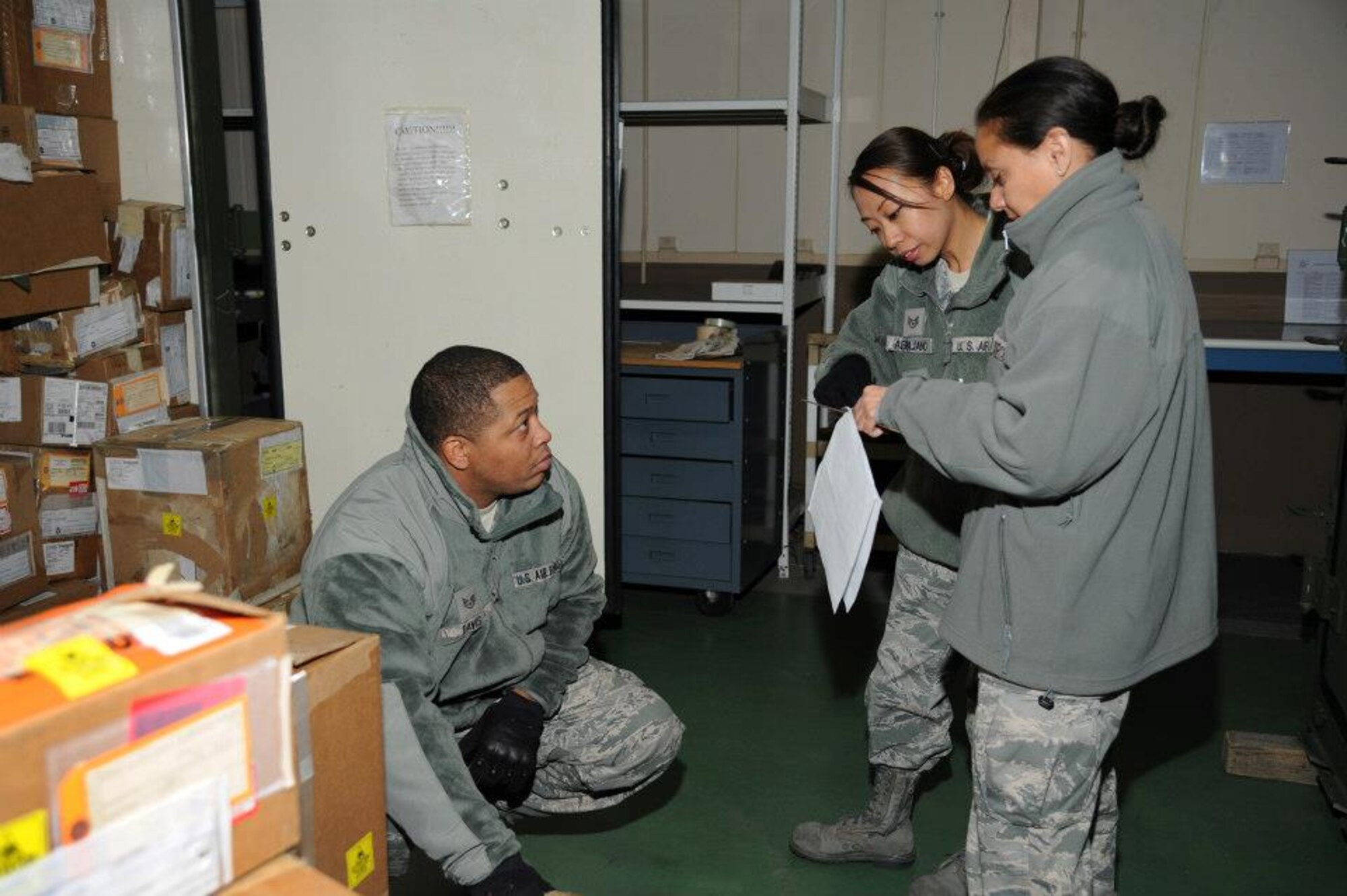 YOKOTA AIR BASE, Japan -- Staff Sgt. Marline Abrajano, 374th Logistics Readiness Squadron, assists Staff Sgt. Sean Davis and Staff Sgt. Eivette Icaza, 927th LRS, with the inventory of an aircraft spares kit February 19, 2013 at Yokota Air Base, Japan.  Performing the inventory allowed the members of the 927th LRS, an Air Force Reserve squadron based at MacDill Air Force Base, Fl., to gain a unique training opportunity not typically seen at their home base.  . (Official U.S. Air Force photo/Staff Sgt. Jannie Chamberlin) 
