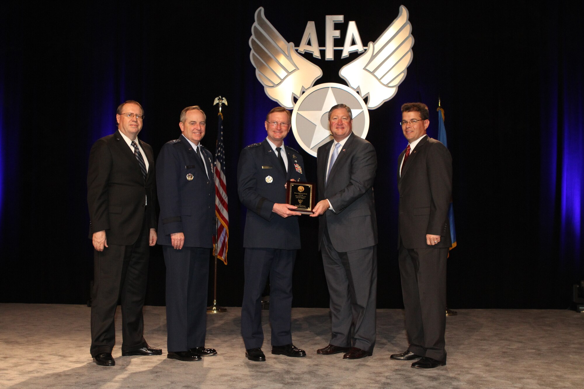 Secretary of the Air Force Michael B. Donley, along with Chief of Staff of the Air Force Gen. Mark A. Welsh III, AFA Central Florida Chapter President Michael Liquori and Air Force Gala Chairman Tim Brock, presents the Jimmy Doolittle Educational Fellow award to Air University Commander Lt. Gen. David S. Fadok. The award presentation was held during the Air Force Association Central Florida Chapter's Air Force Gala banquet in Orlando, Fla., Feb. 21. (Courtesy photo)