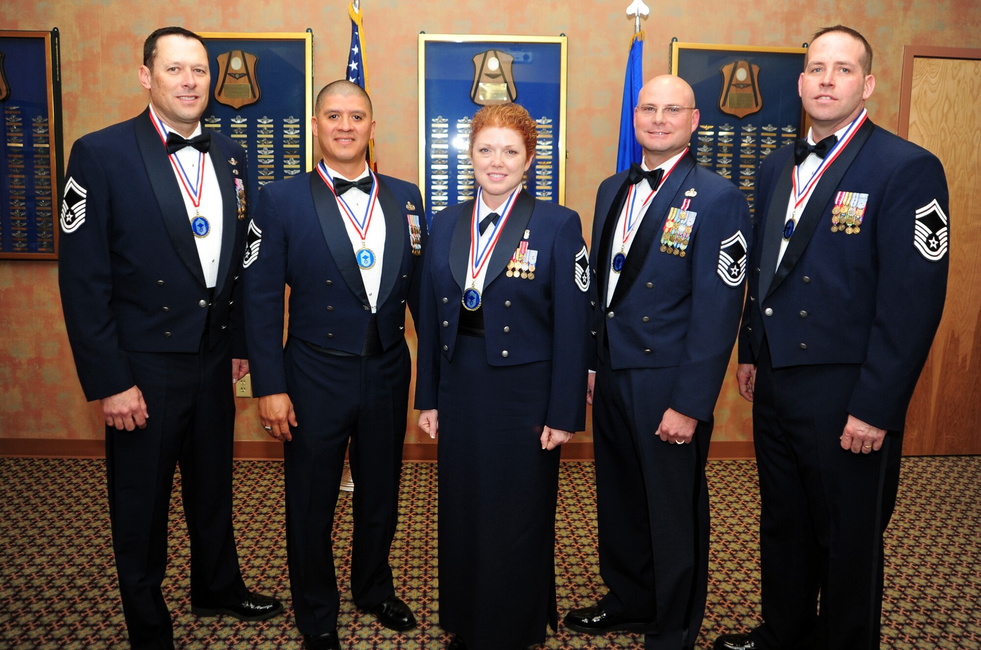 Five of the seven chief master sergeant selectees from the Desert Lightning Team pose for a picture at the Mirage Club at Davis-Monthan Air Force Base, Ariz., Feb. 23, 2013. Chief master sergeant is the highest enlisted rank in the United States Air Force. (U.S. Air Force photo by Senior Airman Camilla Griffin/ Released)