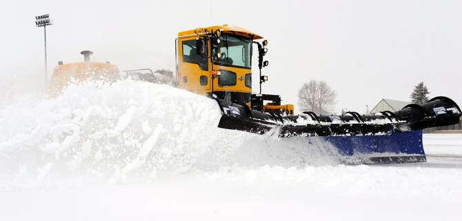 A snow plow from the 92nd Civil Engineer Squadron clears snow from the runway at Fairchild Air Force Base, Wash., Feb. 25, 2013. These vehicles can weigh up to 60 thousand pounds and have a top speed at about 50 miles per hour. (U.S. Air Force photo by Airman 1st Class Ryan Zeski)