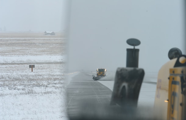Members from the 92nd Civil Engineer Squadron clear snow from the runway using a vehicle known as a snow broom at Fairchild Air Force Base, Wash., Feb. 25, 2013. There are a total of 28 trucks that can be used for snow removal depending on the time of year. (U.S. Air Force photo by Airman 1st Class Janelle Patiño)
