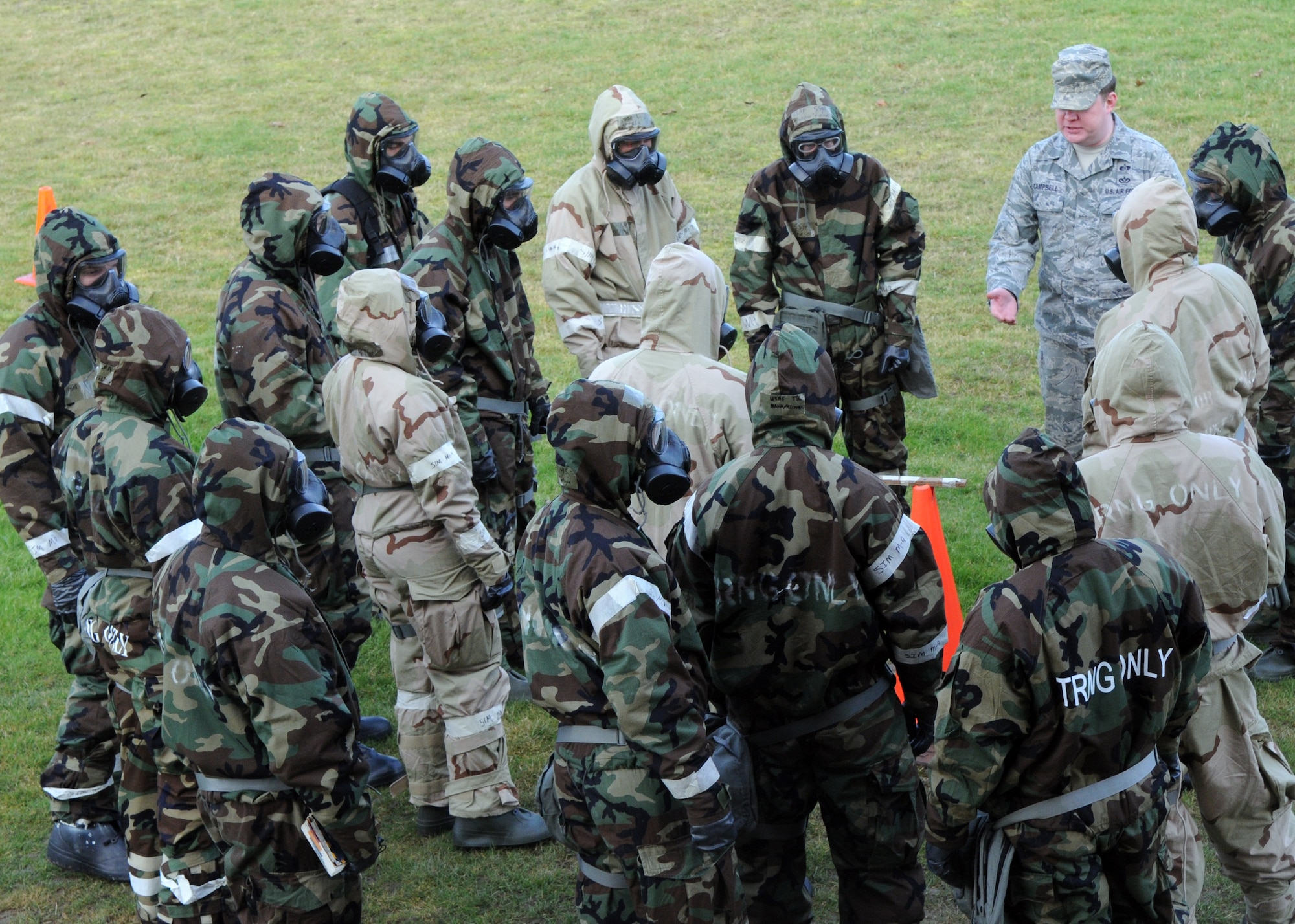 Airmen undergo chemical, biological, radiological and nuclear training Feb. 7, 2013, outside building 680 at RAF Mildenhall, England. During training, students learned about mission-oriented protective postures and how to react in the event of a CBRN situation. (U.S. Air Force photo by Airman 1st Class Kelsey Waters/Released)