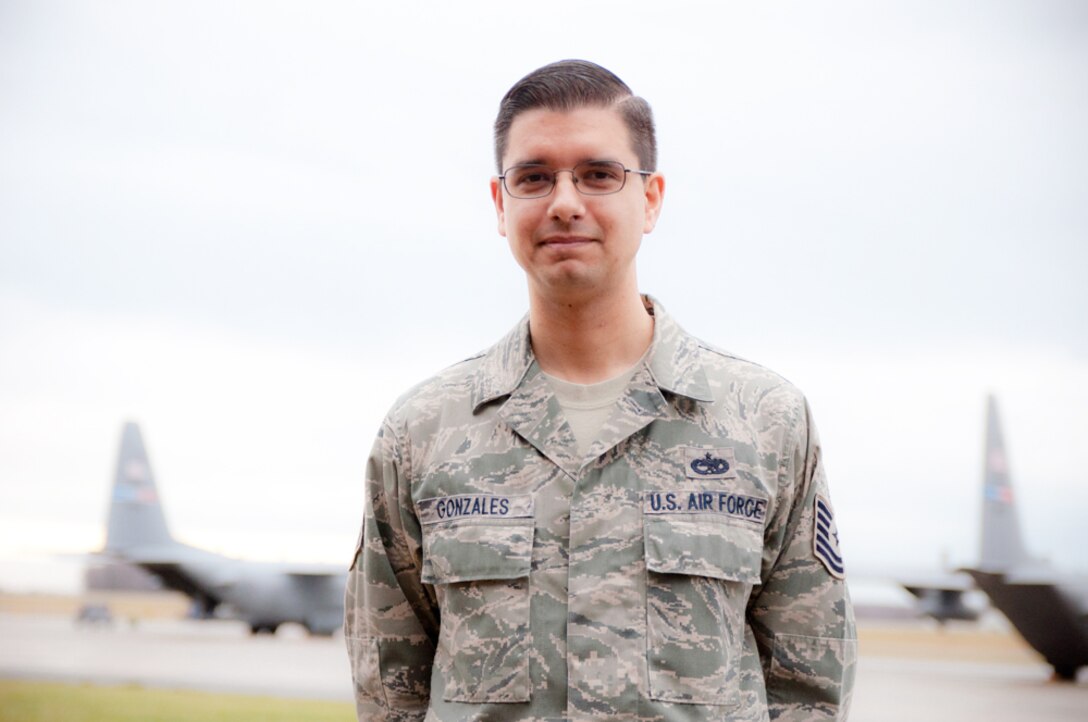 YOUNGSTOWN AIR RESERVE STATION, Ohio -- U.S. Air Force Reserve Tech. Sgt. Donald M. Gonzales, structural maintenance technician with the 910th Maintenance Squadron here, stands on the flightline Jan. 16, 2013 in front of a C-130 here. Gonzales, a native of Valley City and Airman with the 910th Airlift Wing for approximately 13 years, is building a scale C-130 nose mock-up that will hang inside the C-130 Bar and Grille at the Community Activity Center here.U.S. Air Force photo by Tech. Sgt. Brenda Cosola