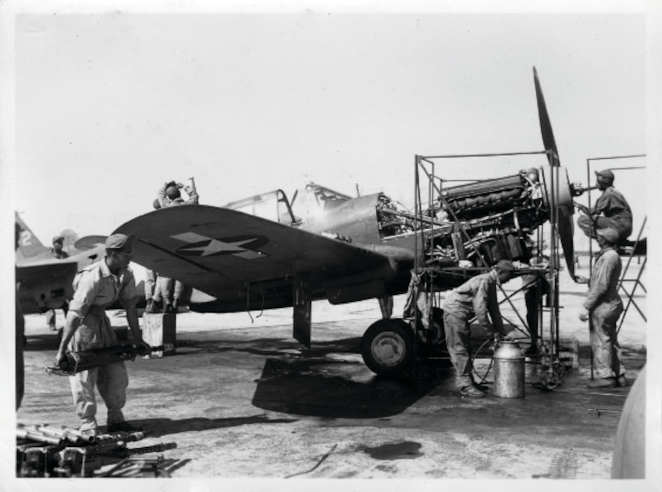 Aircraft mechanics from a “Tuskegee Airmen” unit perform engine maintenance on a P-40 Warhawk at what is now called Selfridge Air National Guard Base in this photo taken likely sometime between March and September 1943, during World War II. During the war, Selfridge served as one of several key training sites for the all-African American units. (Air Force file photo)