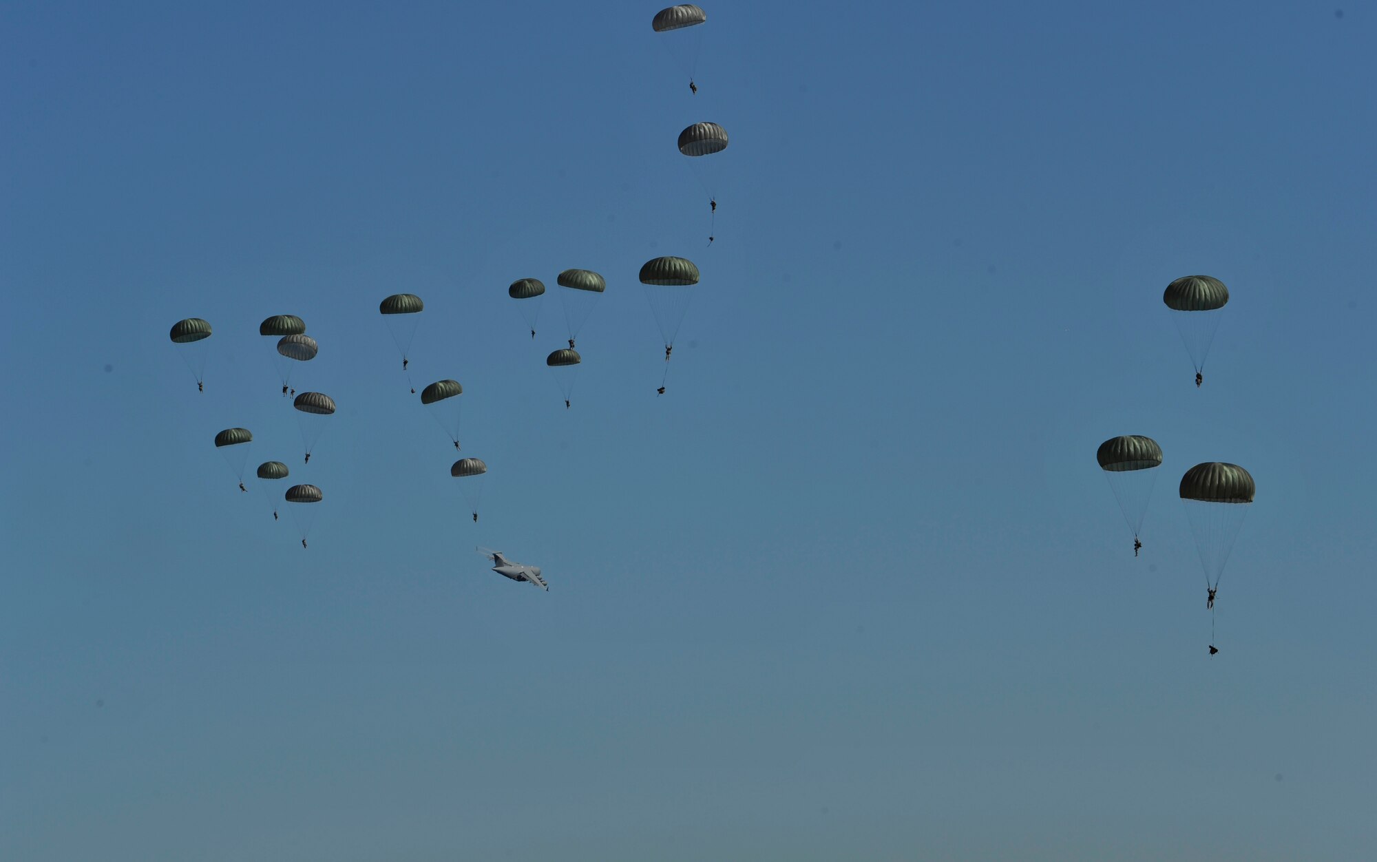 A U.S. Air Force C-130J Hercules aircraft drops Soldiers during Joint Operational Access Exercise (JOAX) 13-02 over Camp Mackall, N.C., Feb. 24, 2013. A JOAX is designed to enhance service cohesiveness between Army and Air Force personnel, allowing both services an opportunity to properly execute large-scale heavy equipment and troop movement. (U.S. Air Force photo by Airman 1st Class Jasmonet Jackson/Released)
