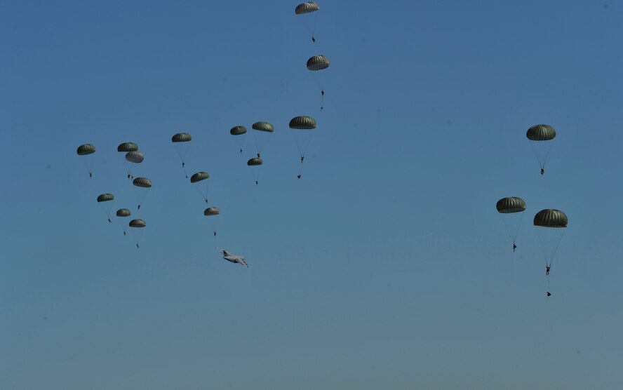 A U.S. Air Force C-130J Hercules aircraft drops Soldiers during Joint Operational Access Exercise (JOAX) 13-02 over Camp Mackall, N.C., Feb. 24, 2013. A JOAX is designed to enhance service cohesiveness between Army and Air Force personnel, allowing both services an opportunity to properly execute large-scale heavy equipment and troop movement. (U.S. Air Force photo by Airman 1st Class Jasmonet Jackson/Released)
