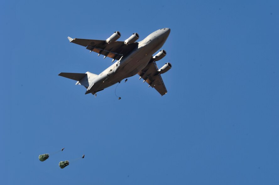 A U.S. Air Force C-17 Globemaster III aircraft drops Soldiers during Joint Operational Access Exercise (JOAX) 13-02 over Camp Mackall, N.C., Feb. 24, 2013. A JOAX is designed to enhance service cohesiveness between Army and Air Force personnel, allowing both services an opportunity to properly execute large-scale heavy equipment and troop movement. (U.S. Air Force photo by Airman 1st Class Jasmonet Jackson/Released) 