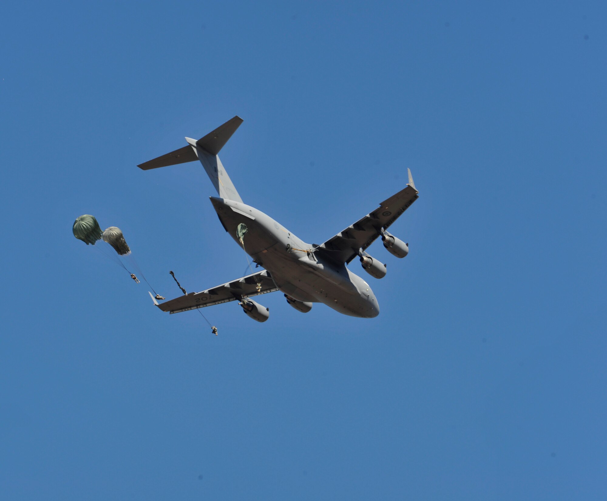 A U.S. Air Force C-130J Hercules aircraft drops Soldiers during Joint Operational Access Exercise (JOAX) 13-02 over Camp Mackall, N.C., Feb. 24, 2013. A JOAX is designed to enhance service cohesiveness between Army and Air Force personnel, allowing both services an opportunity to properly execute large-scale heavy equipment and troop movement. (U.S. Air Force photo by Airman 1st Class Jasmonet Jackson/Released)
